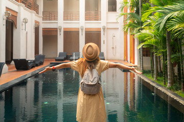 Asian woman relax in resort and swimming pool in Hotel in Chiangmai