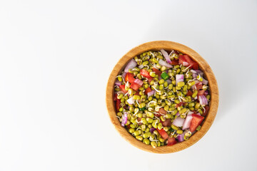Sprouting green gram bean Indian salad with Onion, coriander leaf , green chili and tomatoes. Indian sprouting gram bean salad with isolated background.