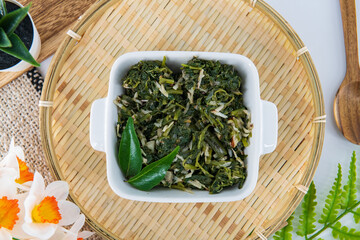 Indian traditional food spinach salad  called Keerti portal or Keerai Thoran in local . Best spinach dish in south india for lunch and dinner. Healthy siru Keerai poriyal isolated