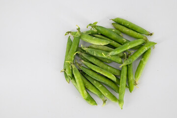Fresh organic green peas. locales called as Patanni fresh Indian vegetable in isolated white background. Fresh organic south Indian green peas in white background..