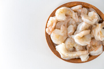 Fresh Raw shrimps cleaned and kept it in a wooden bowl. Raw shrimps in wooden bowl and isolated in white background...