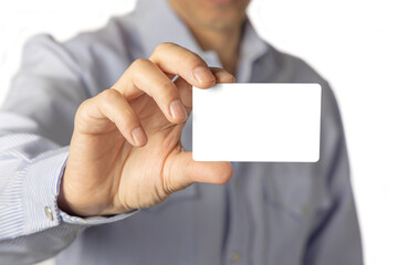 Close up of a man holding a blank card. Selective focus.