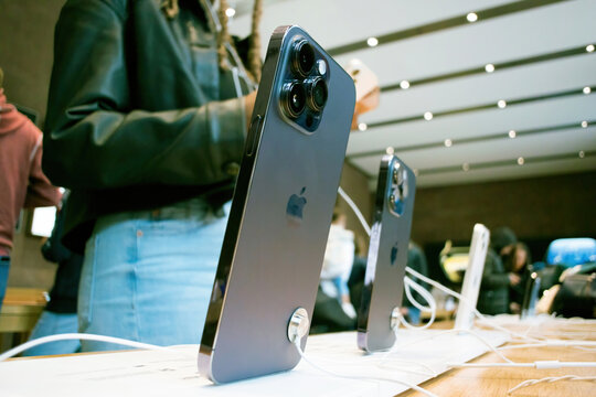 Paris, France - Sep 16, 2022: People testing new Apple Computers iPhone 14, 14 Pro, Pro Max on sale during the launch day featuring Always-on display, 48-megapixel Main camera and Dynamic Island