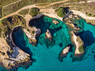 Aerial landscape photography. Straight-down view from flying drone of popular tourist attraction - Torre Sant'Andrea. Wonderful morning seascape of Adriatic sea, Apulia region, Italy