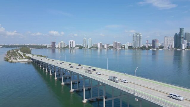alt flying clockwise view of Biscayne Bridge revealing Miami skyline
