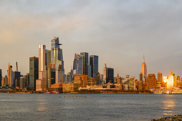 Fototapeta na wymiar New York City Midtown Skyline with Sun Reflection from Hoboken, NJ