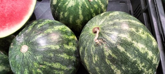 Fresh watermelons on the counter in a supermarket.Selective focus.