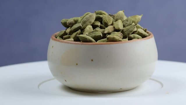 Macro shot of Cardamom also known as Elaichi. Cardamom's natural phytochemicals have antioxidant and anti-inflammatory abilities that could improve health. Different types of Flavored seeds.