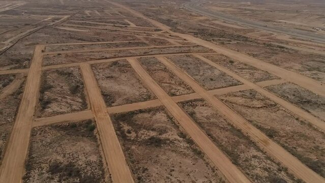 undeveloped lot of land in a new housing estate , Developing the Landscape, An Aerial View of Construction on Empty Land, Developing Land with Construction, Aerial View of Construction in Progress, 