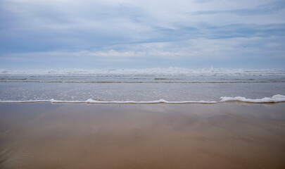 Foam of the waves on the beach