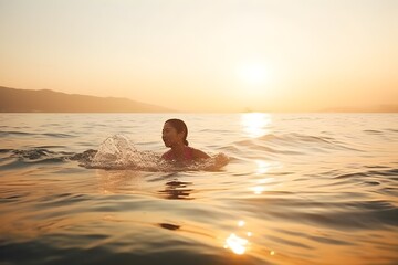 ..A woman swims in the dawn light, embracing the chill of the