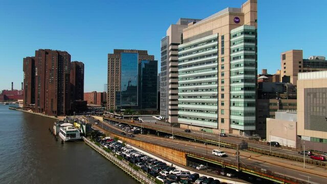 Aerial view of traffic driving FDR Drive NYC Midtown Manhattan East River waterfront NYU Langone Hospital Alexandria Center Life Science