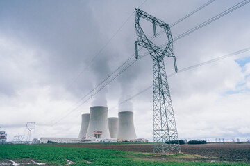 The cooling towers of the Temelín nuclear power plant with a cloudy sky in the background. Nuclear power plant.