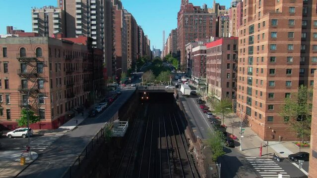 Establishing Aerial of NYC Train Park Ave tunnel subway metro north rising reveal Manhattan buildings upper east side Central Park cityscape  96th Street traffic 