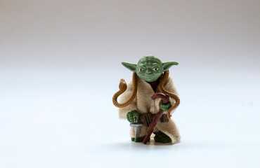 Obraz premium Vintage Star Wars Yoda Action Figure from Kenner Toys with Snake on White. This was released with the Movie 