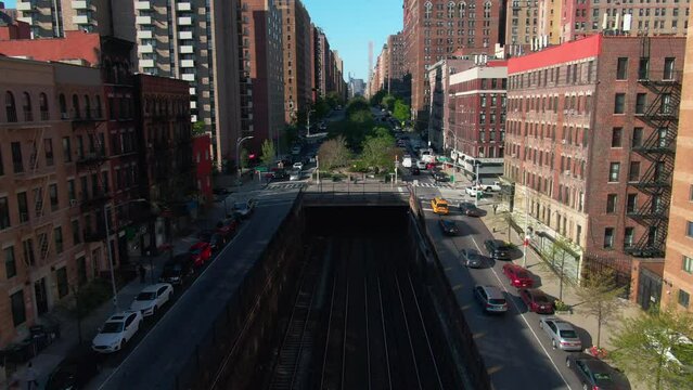 NYC city street traffic upper east side Manhattan taxi 96th street subway train tracks Park Ave
