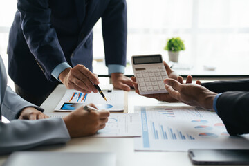 Close up view of business people working with new project, presentating and analyzing the marketing and investment plan.