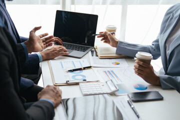 Close up view of business people working with new project, presentating and analyzing the marketing and investment plan.