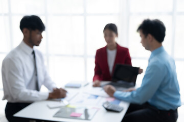 Fototapeta na wymiar Blurred image of businesspeople working together in the meeting room.
