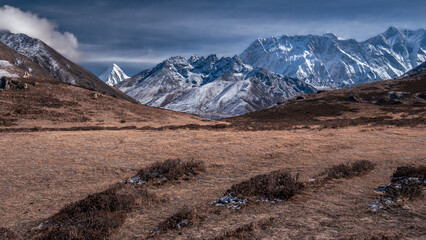 Landscape with valley against backdrop of the snowy Mount Lhotse and Mount Pumori, Nepal, Himalayas
