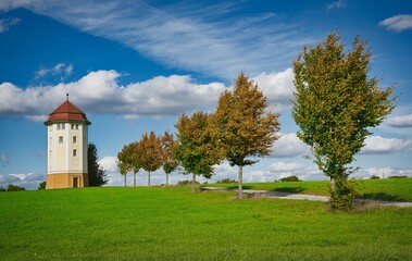 Hohenstadt water tower in the field with trees lined up near the path