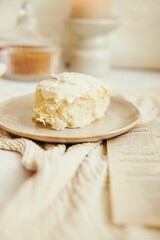 Vertical shot of delicious cinnamon Buns with cream on a white table