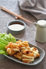 cakue udang or shrimp roll cake with mayonaise on the table. selective focus
