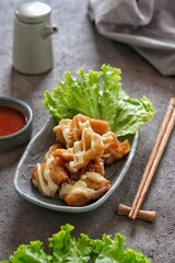 cakue udang or shrimp roll cake with mayonaise on the table. selective focus