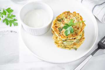 Zucchini dill parsley fritters with Greek Yogurt Sauce