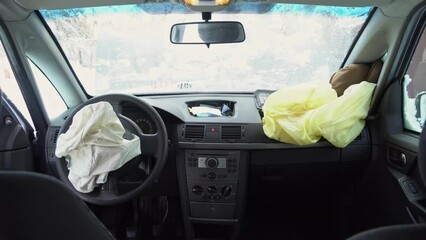 Deployed car airbags after a collision, car accident, vehicle security system after car crash. Deflated air bag