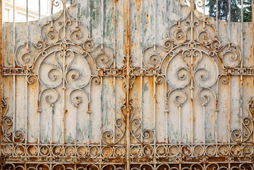 background of a rusty metallic gate with metallic ornaments