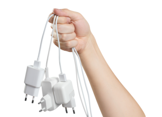 Hand holding white plugs, cut out