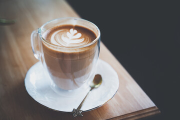 Hot coffee cup on table  Late art coffee