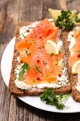 tosted bread with cream cheese and smoked salmon- canape, sandwich