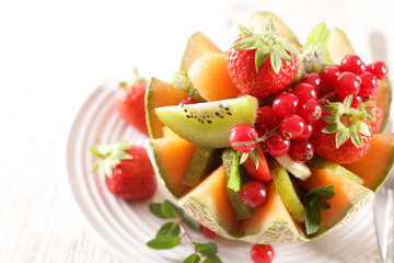 mixed fruit salad in melon bowl