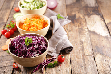 various bowl of vegetable salad- cabbage, carrot and cucumber