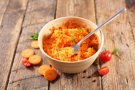 fresh grated carrot in bowl