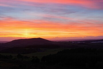 Intense sunset silhouetting Corndon Hill, Wales