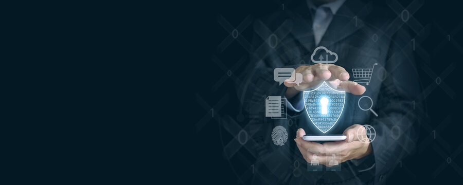 Securely Navigating the Digital World: Businessman's Hand Holds Smartphone with Virtual Shield Icon and Internet Icons for Protection.