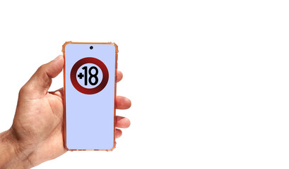 Hand holding a phone with 18 years limitation sign on screen