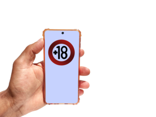 Hand holding a phone with 18 years limitation sign on screen