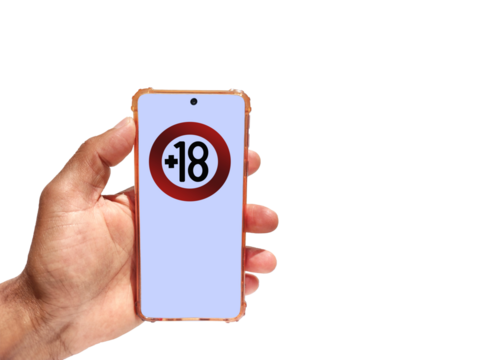 Hand holding a phone with 18 years limitation sign on screen