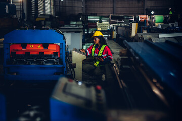 Fototapeta premium Foreman or worker work at factory site check up machine or products in site. Engineer or Technician checking Material or Machine on Plant. Industrial and Factory.