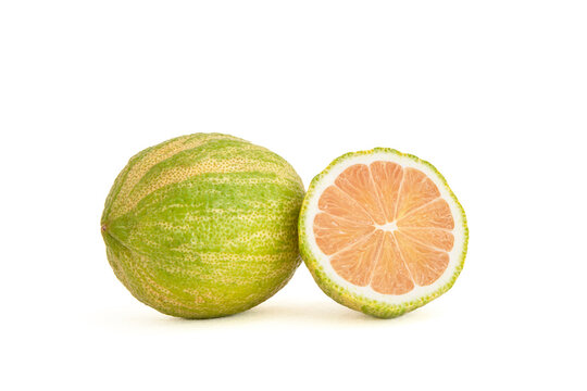 Close-up of pink lemons with stripes on a white background