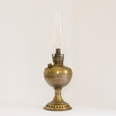 Antique brass oil lamp isolated on white background. 