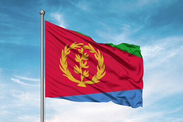 Eritrea national flag cloth fabric waving on beautiful sky Background.