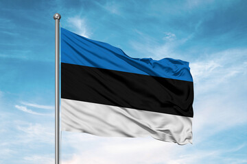 Estonia national flag cloth fabric waving on beautiful sky Background.