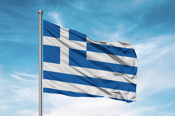 Greece national flag cloth fabric waving on beautiful sky Background.