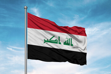 Iraq  national flag cloth fabric waving on beautiful sky Background.