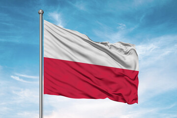 Fototapeta na wymiar Poland national flag cloth fabric waving on beautiful sky Background.